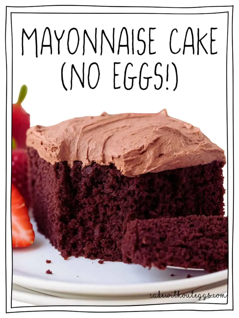 Moist chocolate mayonnaise cake slice with rich frosting and fresh strawberries on a white plate